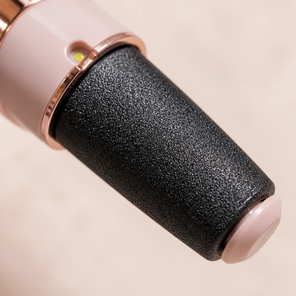 Macro product detail photography, 1:1 square. Extreme close-up of the black abrasive roller head of